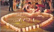  ??  ?? Candleligh­t vigil at the Kunming terror attack site.
AFP