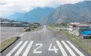  ?? /Loop Images/Getty Images/Universal Images Group ?? Short strip: A view of the runway at Tenzing-Hillary airport from the pilot’s perspectiv­e.