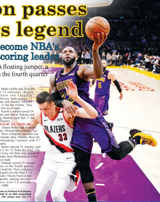  ??  ?? Los Angeles Lakers forward LeBron James, right, shoots as Portland Trail Blazers forward Zach Collins defends during the second half of an NBA basketball game Wednesday, Nov. 14, 2018, in Los Angeles. The Lakers won 126-117.