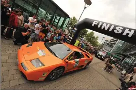  ??  ?? Spectators getting ‘up close and personal’ to the super-cars the last time Cannonball Ireland finished in Cork four years ago.