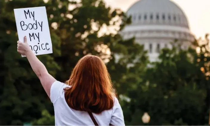  ?? Photograph: Allison Bailey/NurPhoto/REX/Shuttersto­ck ?? A person holds a sign reading ‘My body my choice’ during a protest in Washington DC in May.