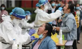  ??  ?? Open-air coronaviru­s testing gets under way in Wuhan, Hubei province. Photograph: AFP/Getty