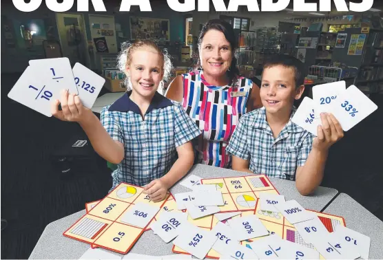  ?? Picture: SCOTT RADFORD- CHISHOLM ?? CLASS ACT: Good Shephered Catholic College Students Aisha Duffin and Elann Malot with assistant principal of religious education Nicole Preitz. The numbers looked good for the school in the latest NAPLAN results.