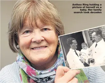  ??  ?? Anthea Ring holding a picture of herself as a baby. Her family search took decades