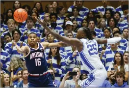  ?? NELL REDMOND — THE ASSOCIATED PRESS ?? Arizona forward Keshad Johnson (16) battles Duke forward Mark Mitchell (25) for a rebound during the first half in Durham, N.C., on Friday.