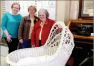  ?? JONATHAN TRESSLER — THE NEWS-HERALD ?? Surrounded by artifacts on display at the Madison Historical Society History Center and Gift Shop, President Dianne Cross, left; office manager/membership chair Marje Shook, center; and past president/longtime board member Nancy Hearn pose March 28 for...