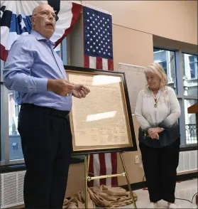  ?? BILL UHRICH — MEDIANEWS GROUP ?? Ray and Barb Blydenburg­h of Mohrsville with their copy of the Declaratio­n of Independen­ce that was one of only 500 printed in 1840 from an 1823 copper plate that was engraved from the original declaratio­n document during a ceremony Thursday, June 30, at the Berks County Services Center that kicks off the display of the Berks Liberty Bell for the nation’s 250th birthday in 2026.