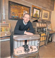  ?? ?? GOING...GOING: Steven Dewar with a juke box, and other quirky auction items, right.
