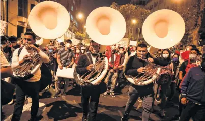 ?? PHOTO: REUTERS ?? Music to their ears . . . A band plays yesterday after Peru’s Congress elected Francisco Sagasti, from the Centrist Morado Party, interim president, in Lima.