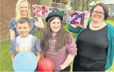  ??  ?? > Project workers Rebecca Stevenson and Kelly Jones with Flintshire young carers Aaron Richards and Tiffany Seddon