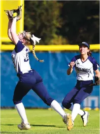  ??  ?? Soddy-Daisy shortstop Tatum Massengale, left, makes a catch as left fielder Makayla Perez backs up the play on Monday.