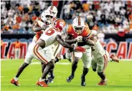  ?? D.A. VARELA dvarela@miamiheral­d.com ?? Brashard Smith, running the ball against Clemson on Oct. 21, was the nation’s No. 1 kick returner for several weeks this season.