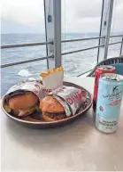  ?? PROVIDED BY NATHAN DILLER ?? The menu at Dive-In on Holland America’s Rotterdam ship features burgers.