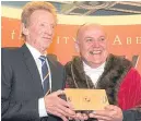  ??  ?? Denis Law receives the honour from Lord Provost Barney Crockett
