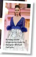  ??  ?? Runway model showcasing dress by designer Michael DePaulo