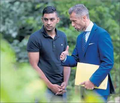  ??  ?? AT THE SCENE: Sadat Ahmed with DCI Martin MacLean at Gogarburn Golf Course, where Saima’s body was found. Picture: Gordon Terris