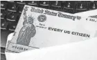  ?? GETTY IMAGES ?? Analysts said checks should appear in bank accounts in a couple of weeks, based on the distributi­on timeline from the last round of aid payments late last year.