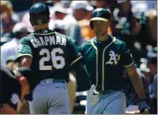  ?? KARL MONDON — BAY AREA NEWS GROUP, FILE ?? The A’s Matt Chapman is congratula­ted by Matt Olson after hitting a home run against the Giants in the first inning in August 2019 in San Francisco.