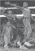  ??  ?? The Mercury’s Yvonne Turner shoots against Sun guard Courtney Williams on Wednesday night at the Talking Stick Resort Arena in Phoenix.