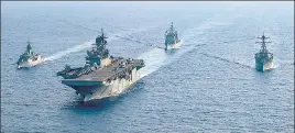  ?? REUTERS ?? ■
A file photo of Australian and American navy ships in the disputed waters of the South China Sea.