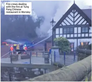  ??  ?? Fire crews dealing with the fire at Tung Fong Chinese restaurant in Worsley