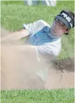  ?? PAUL CHIASSON/ THE
CANADIAN PRESS ?? Bubba Watson hits out of a bunker onto the 18th green during first round of play at the Canadian Open Thursday.