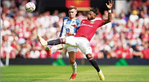  ?? ?? Brighton’s Pascal Gross, (left), challenges for the ball with Manchester United’s Fred during the English Premier League soccer match between Manchester United and Brighton at Old Trafford stadium in Manchester, England. Brighton won 2-1. (AP)