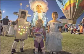  ??  ?? Miles Anderson, Mason Anderson, Alyssa Davids and Jasmyn Davids enjoy the Salt River Fields Balloon Spooktacul­ar at Salt River Fields at Talking Stick on Oct. 23, 2015.