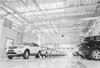  ?? — Reuters photo ?? File photo shows a Geely factory in China. More Geely models are expected to be introduced with attractive pricing to turn around Proton.