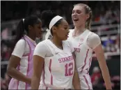  ?? GODOFREDO A. VÁSQUEZ — THE ASSOCIATED PRESS ?? Stanford guard Indya Nivar (12) celebrates with forward Cameron Brink, right, after a block against Southern California during the first half in Stanford on Friday.