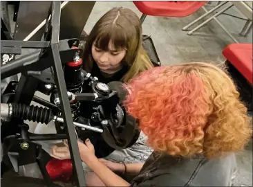  ?? PHOTOS COURTESY JOHN TYLER ?? Lower Lake students Lily Tapia and Susie Steiger work on a project in the Lower Lake High School auto program.