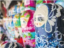  ??  ?? Matryoshka — traditiona­l hand-painted wooden nesting dolls in vibrant colours — are a popular Russian souvenir.