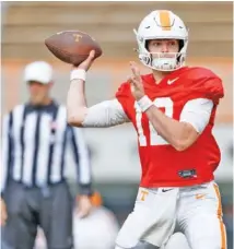  ?? TENNESSEE ATHLETICS PHOTO BY IAN COX ?? Tennessee freshman quarterbac­k Jake Merklinger competes during Wednesday’s first spring scrimmage inside Neyland Stadium.