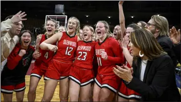  ?? AARON ONTIVEROZ — THE DENVER POST ?? Glenwood Springs players Taia Nykerk (4), Bailey Winder (12), Breauna Sorenson (23) and Mattea Enewold (11) celebrate with teammates after Glenwood Springs’ 48-41 win over George Washington in the Great 8 round of the CHSAA state basketball tournament on Thursday at the Denver Coliseum.