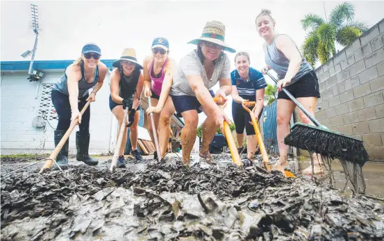  ?? Picture: LACHIE MILLARD ?? DISEASE DANGER: ‘Sister Army’ Jayde Carter, Rachel Cussin, Grace Philp, Janelle Caisley, Kiera Archer and Louise Herring clear mud and debris from a home in Rosslea after February’s Townsville floods, a disaster which sparked a public health fear due to waterborne bacteria.