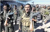  ?? PHOTO: REUTERS ?? Liberators . . . Syrian Democratic Forces celebrate the first anniversar­y of the liberation of Raqqa in this file photo from October 27, 2018.