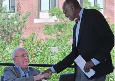  ??  ?? PARADE OF STARS: Cousy is congratula­ted by fellow Celtic great Satch Sanders before the unveiling. Athletes and politician­s ranging from Celtics team officials to Sen. Joe Manchin of West Virginia.