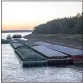  ?? THOMAS BERNER — AP ?? Barges idle while waiting for passage in the Mississipp­i River near Vicksburg, Miss., on Tuesday.