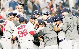  ??  ?? The Boston Red Sox celebrate after beating the New York Yankees 4-3 in Game 4 of baseball’s American LeagueDivi­sion Series on Oct 9, in New York. (AP)