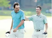 ?? Photograph: CLIFF HAWKINS/ GETTY IMAGES ?? TOP SPOTS: Scottie Scheffler of the US congratula­tes Northern Ireland’s Rory McIlroy after he won the final round of the Tour Championsh­ip in Atlanta, Georgia, last year