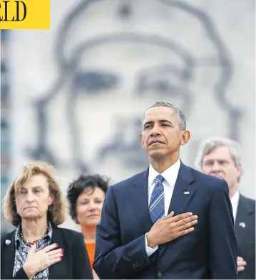  ?? DENNIS RIVERA / THE ASSOCIATED PRESS ?? Standing in front of a monument depicting Cuba’s revolution­ary hero Ernesto “Che” Guevara, U.S. President Barack
Obama listens to the U.S. national anthem during a ceremony at the Jose Marti Monument in Havana, Monday.