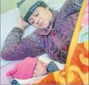  ?? HT PHOTO ?? ■ Shimpu Devi, wife of slain soldier Ranjeet Singh Bhutyal, with her newborn at Ramban district hospital on Tuesday.