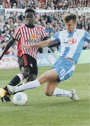  ??  ?? Sunderland’s Joel Asoro is closed down by Hartlepool’s Rhys Oates.