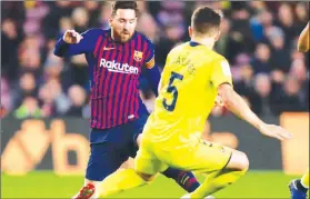  ?? (AP Photo/Manu Fernandez) ?? FC Barcelona's Lionel Messi (left) duels for the ball with Villarreal's Santiago Caseres during the Spanish La Liga soccer match between FC Barcelona and Villarreal at the Camp Nou stadium in Barcelona, Spain, Sunday, Dec. 2, 2018.