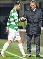  ?? Picture: SNS. ?? Patrick Roberts is consoled by manager Brendan Rodgers after suffering the hamstring injury that has kept him out since November.