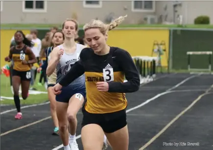  ?? Photo by Kris Everett ?? Alison Smith crosses the line in first ahead of Bellmont’s Sydney Keane in the 400 at this weekend’s South Adams Track & Field Invite. The Starfires won the girls meet with 109 team points.