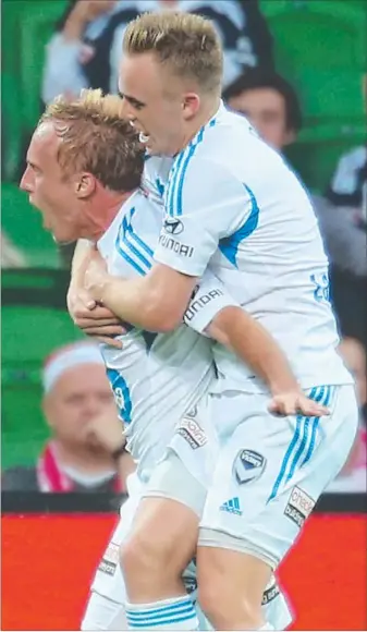  ?? Picture: SCOTT BARBOUR ?? Mitch Nichols piggybacks teammate Connor Pain as he celebrates one of his two goals for Melbourne Victory against Melbourne Heart at AAMI Park last night