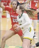  ??  ?? Jenn March / Special to the Times Union Siena's Margo Peterson drives past Marist's Zaria Demembersh­azer. Peterson led the Saints with 18 points on Saturday.