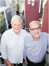  ??  ?? West Vancouver mayor Michael Smith cut the ribbon on co-developer Michael Geller’s four-residence Vinson House Cottages project.