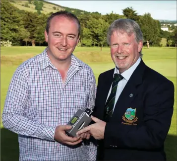  ??  ?? Baltinglas­s Golf Club Presidents Prize winner Sean O’Reilly receives his prize from President Fintan Doyle.